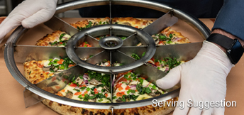 a chef using a large pizza slicing tool