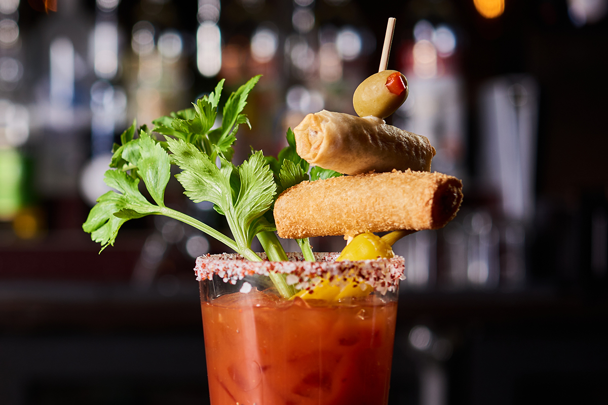 bloody mary with egg rolls on a skewer