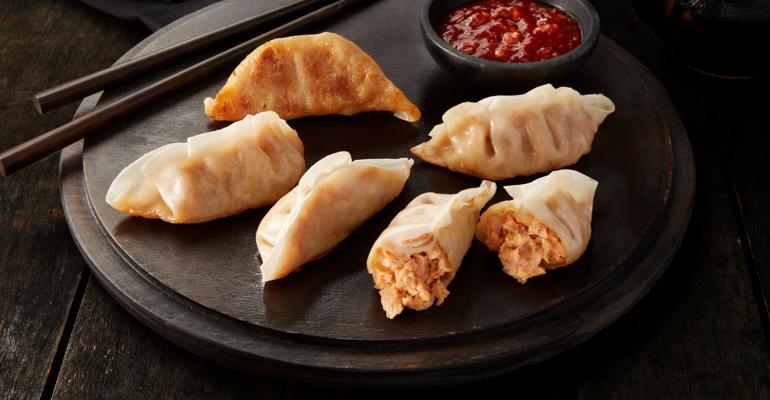 prepared dumplings on a serving tray