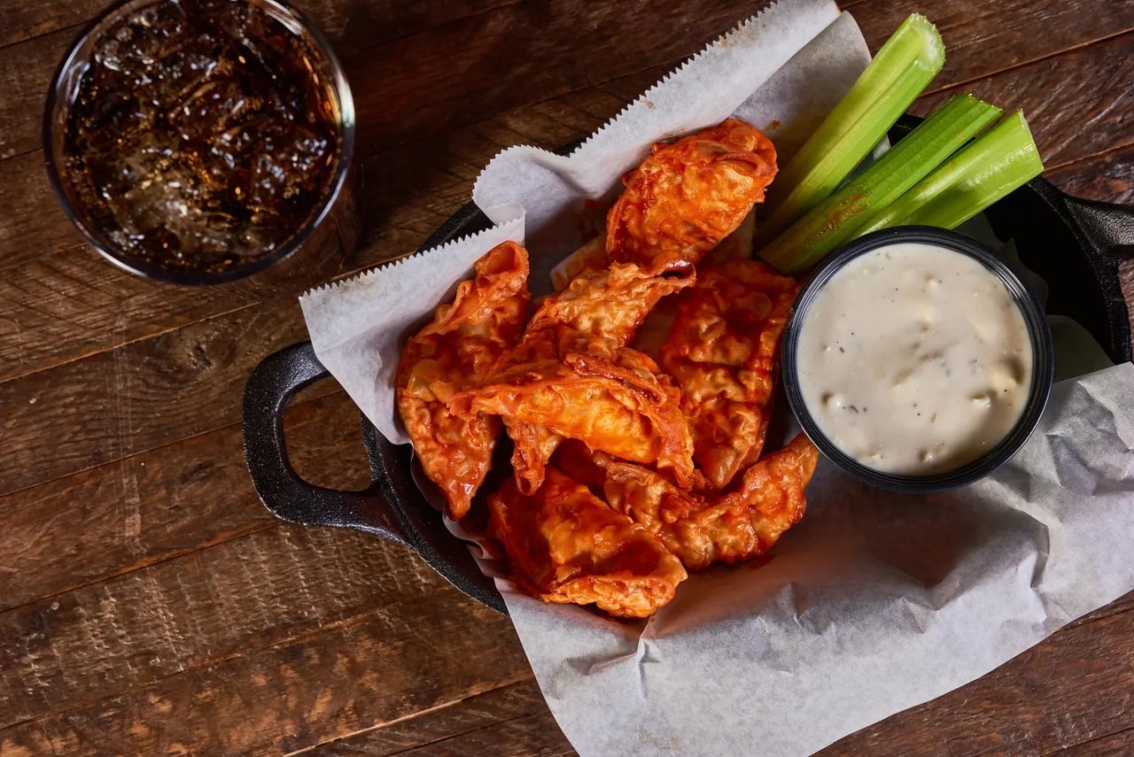 Fried dumplings in buffalo sauce